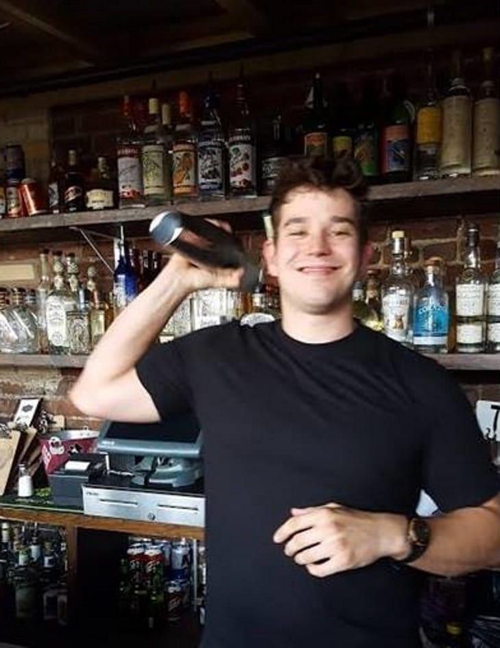 PBS graduate shaking cocktails behind a real bar