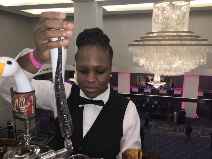 PBS graduate bartending an event