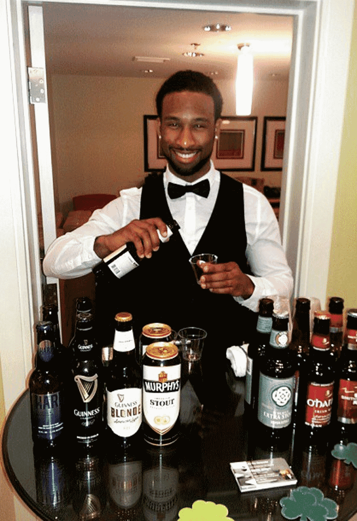 PBS graduate bartending an event