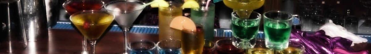 Colorful craft cocktails lined up on the bar
